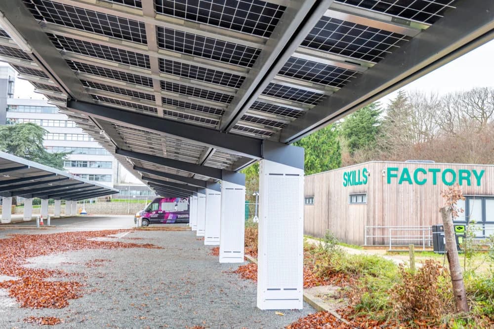 Row of double-cantilever solar carport structures